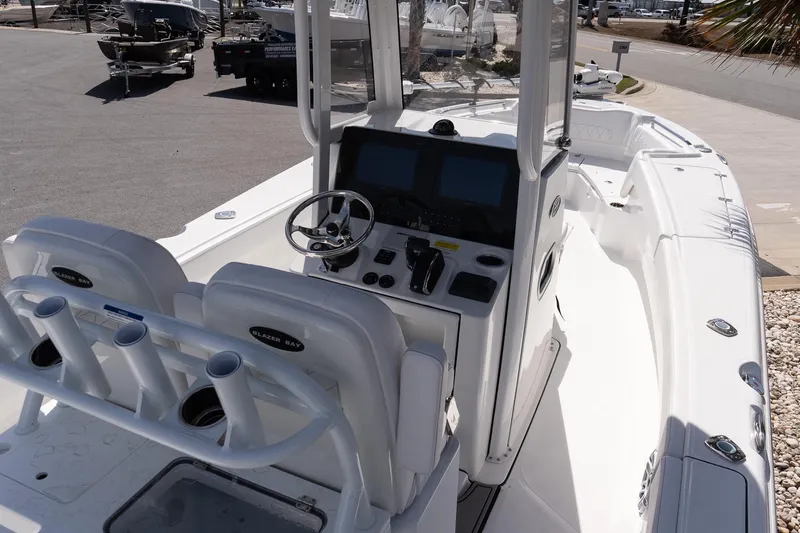 Slide: The Image of 2026 Blazer Bay Makaira 2800 boat interior with steering console and seating. - 10