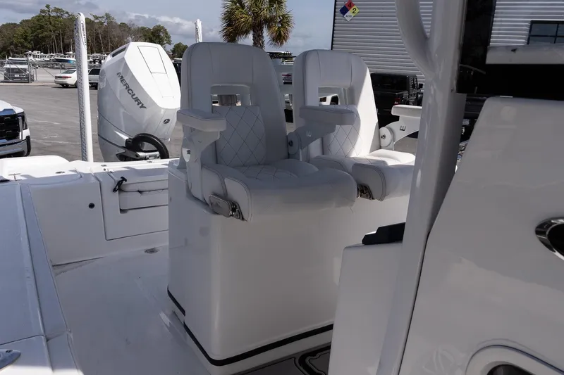 Slide: The Image of 2026 Blazer Bay Makaira 2800 boat interior with dual white captain seats. - 12