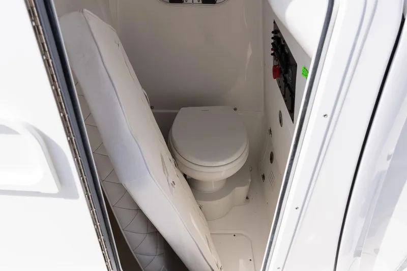 Slide: The Image of 2026 Blazer Bay Makaira 2800 boat interior with compact toilet and control panel. - 16