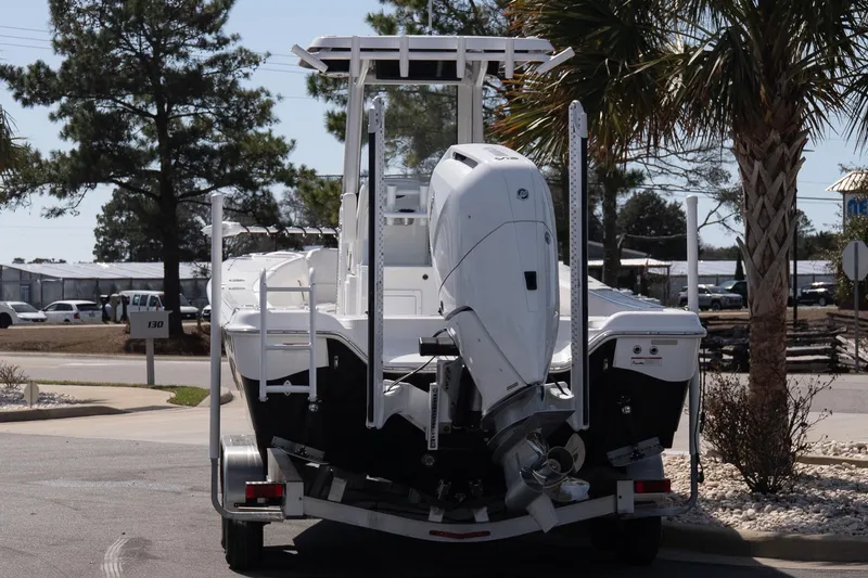 Slide: The Image of 2026 Blazer Bay Makaira 2800 boat on trailer, rear view, parked outdoors. - 4