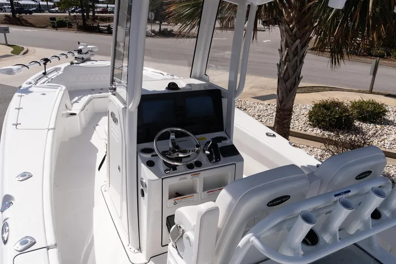 Slide: The Image of 2026 Blazer Bay Makaira 2800 boat interior with steering console and seating. - 9