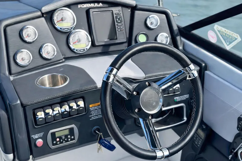 Slide: The Image of 2015 Formula 240 Bowrider boat seat with elegant upholstery and branding. - 10