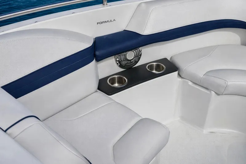 Slide: The Image of 2015 Formula 240 Bowrider boat seat with blue and white upholstery. - 18