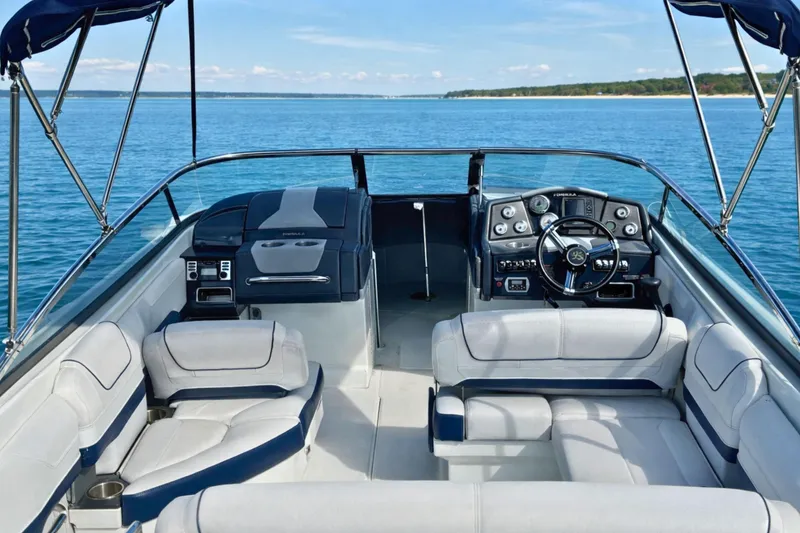 Slide: The Image of 2015 Formula 240 Bowrider boat seat with logo, featuring sleek upholstery design. - 4