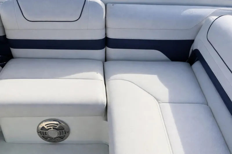 Slide: The Image of 2015 Formula 240 Bowrider interior seating with blue and white upholstery. - 6