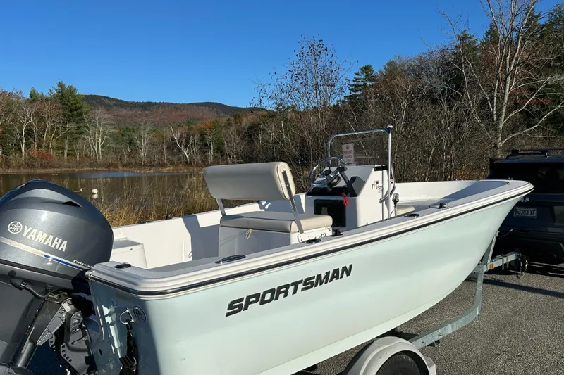 Slide: The Image of 2017 Sportsman Island Reef 17 Center Console boat with Yamaha engine by a scenic lake. - 4