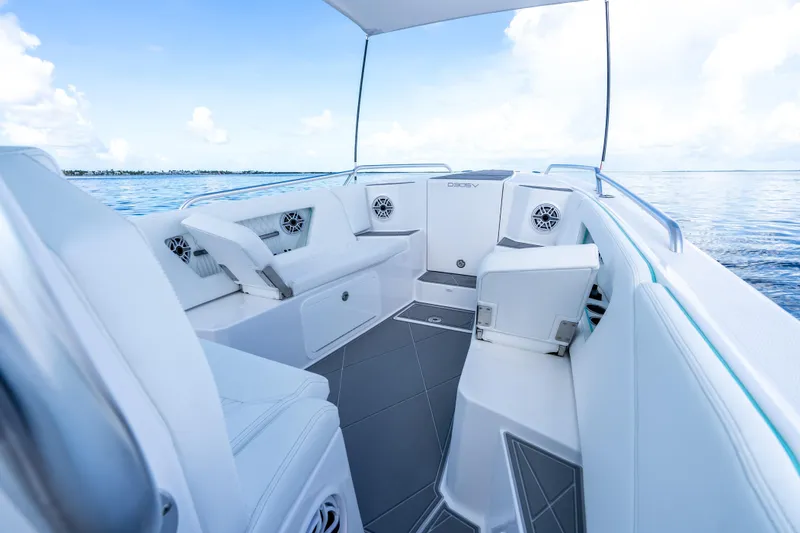 Slide: The Image of Luxurious interior of 2024 Dynamic D-305V boat with sleek seating and ocean view. - 10
