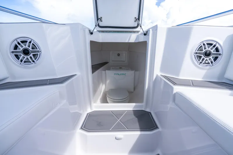 Slide: The Image of 2024 Dynamic D-305V boat interior with speakers and compact toilet. - 13