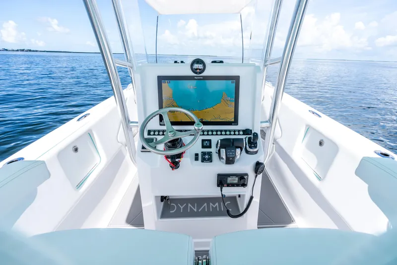 Slide: The Image of 2024 Dynamic D-305V boat cockpit with navigation system on open water. - 18
