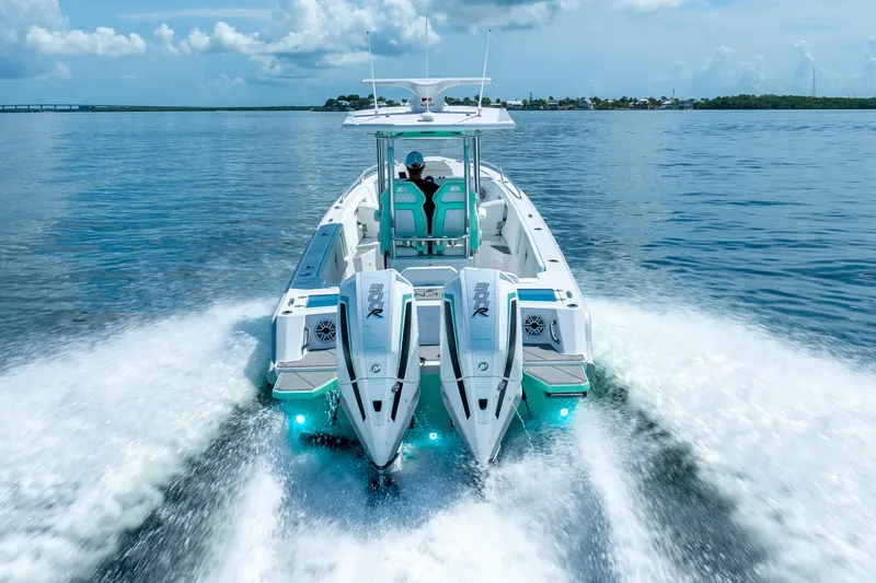 Slide: The Image of 2024 Dynamic D-305V boat cruising on open water, showcasing powerful dual engines. - 6