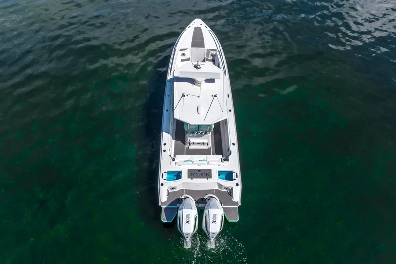 Slide: The Image of 2024 Dynamic D-305V boat on clear water, aerial view. - 8