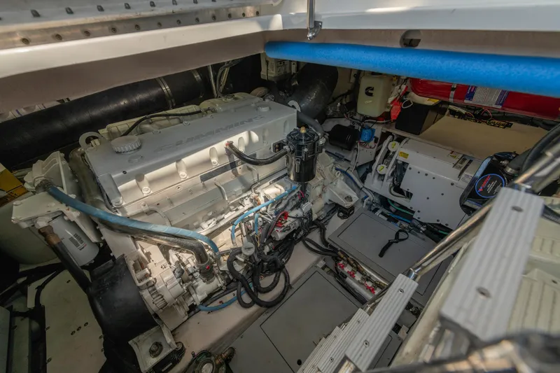 Slide: The Image of Engine room of a 2017 Sea Ray Fly 510 yacht, showcasing mechanical components. - 95