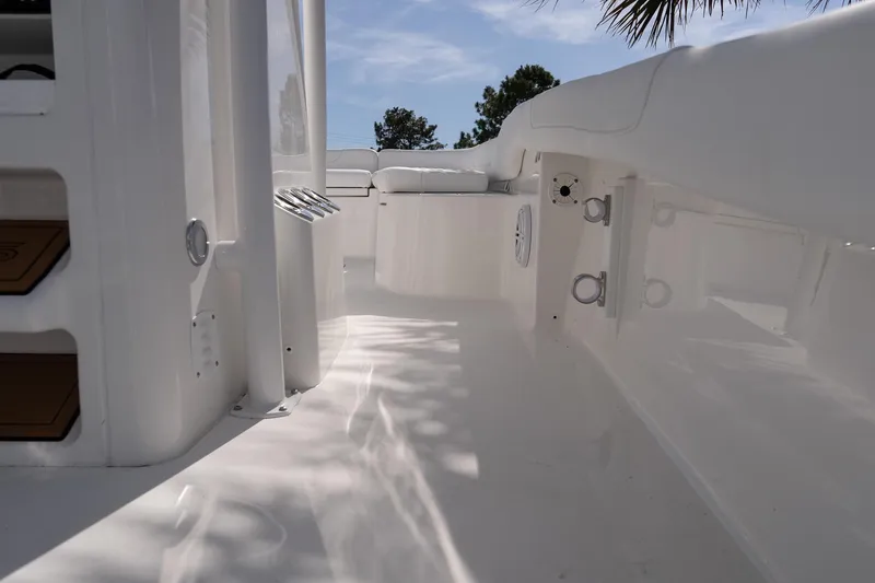 Slide: The Image of 2026 Caymas 24 HB boat interior with sleek white design and modern features. - 16