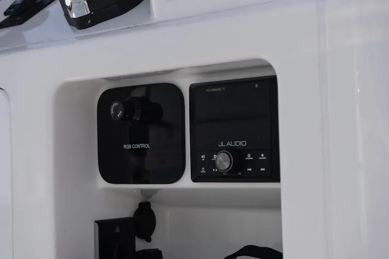 Slide: The Image of Control panel on 2026 Caymas 24 HB boat featuring RGB and JL Audio systems. - 17