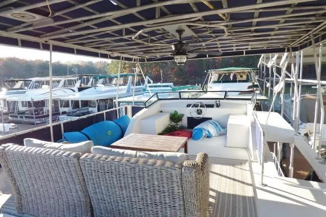 Slide: The Image of Upper deck of a 2001 Starlite 15x67 houseboat with seating and helm. - 10