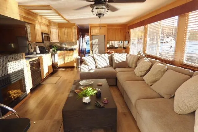 Slide: The Image of Luxurious Starlite 15x67 houseboat interior with modern kitchen and cozy living area, 2001 model. - 2