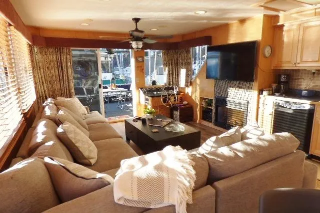 Slide: The Image of Luxurious interior of 2001 Starlite 15x67 houseboat with cozy seating and modern amenities. - 3