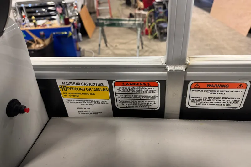 Slide: The Image of 2023 Ranger Reata 220F capacity and warning labels, maximum 10 persons or 1388 lbs. - 13