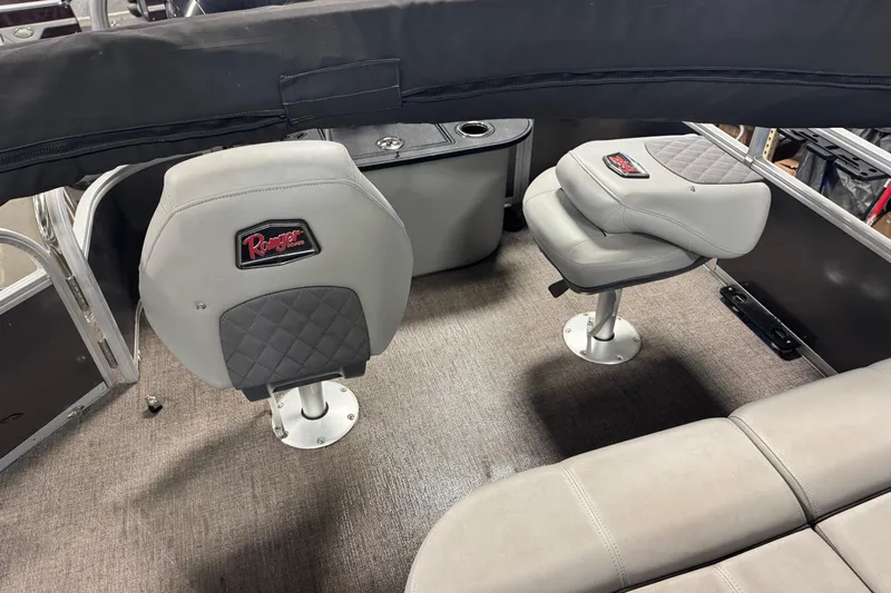 Slide: The Image of 2023 Ranger Reata 220F boat interior with cushioned seating and modern design. - 16