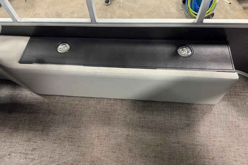 Slide: The Image of 2023 Ranger Reata 220F boat interior storage compartment with secure latches. - 18