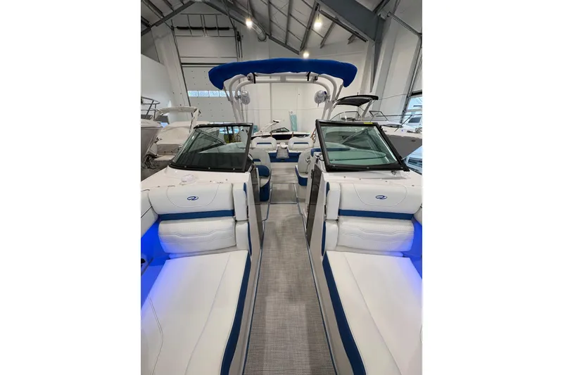 Slide: The Image of 2026 Regal LS6 Surf boat interior with blue accents and modern design. - 10