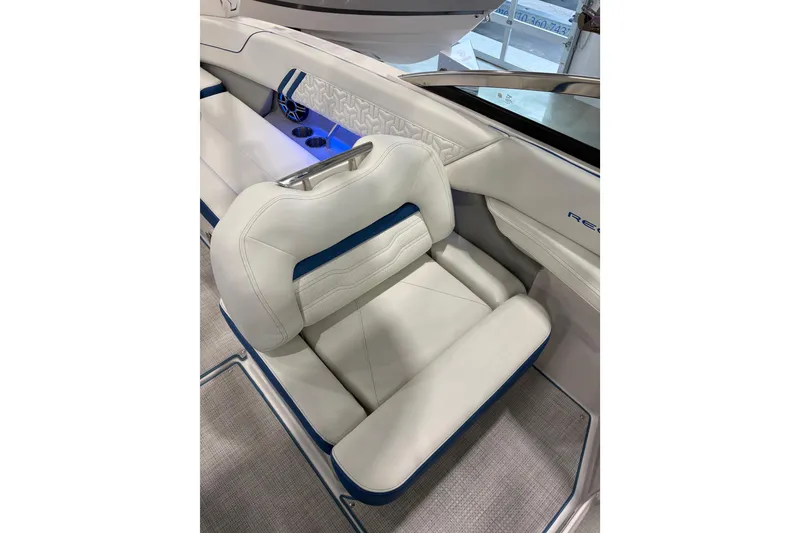 Slide: The Image of 2026 Regal LS6 Surf boat interior with luxurious white and blue seating. - 19