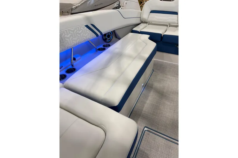 Slide: The Image of Luxurious interior of 2026 Regal LS6 Surf boat with blue LED lighting and cushioned seating. - 21