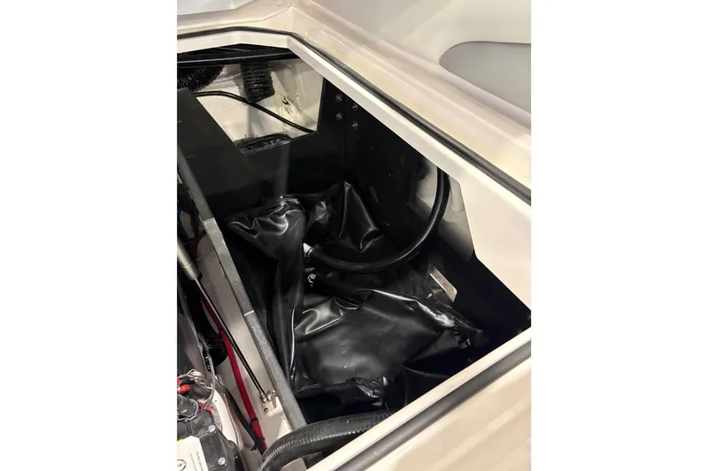 Slide: The Image of Engine compartment of 2026 Regal LS6 Surf boat, showcasing internal components and wiring. - 31