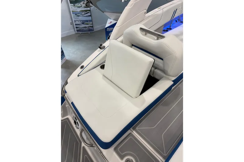 Slide: The Image of 2026 Regal LS6 Surf boat interior with white seating and blue accents. - 32