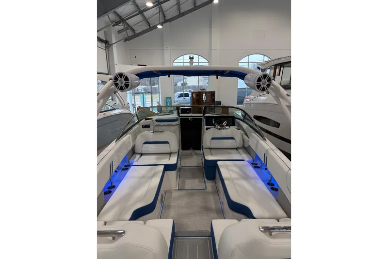 Slide: The Image of 2026 Regal LS6 Surf boat interior with blue LED lighting and white seating. - 35