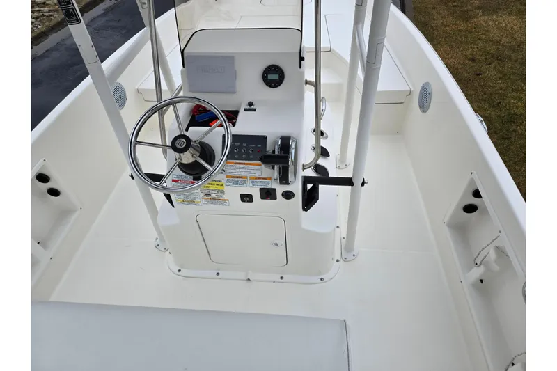 Slide: The Image of 2022 Bayliner Trophy T21Bay boat interior with steering console and controls. - 11