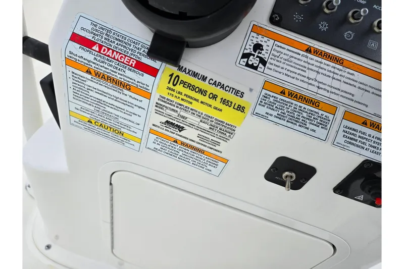 Slide: The Image of 2022 Bayliner Trophy T21Bay boat dashboard with safety and capacity warnings. - 13