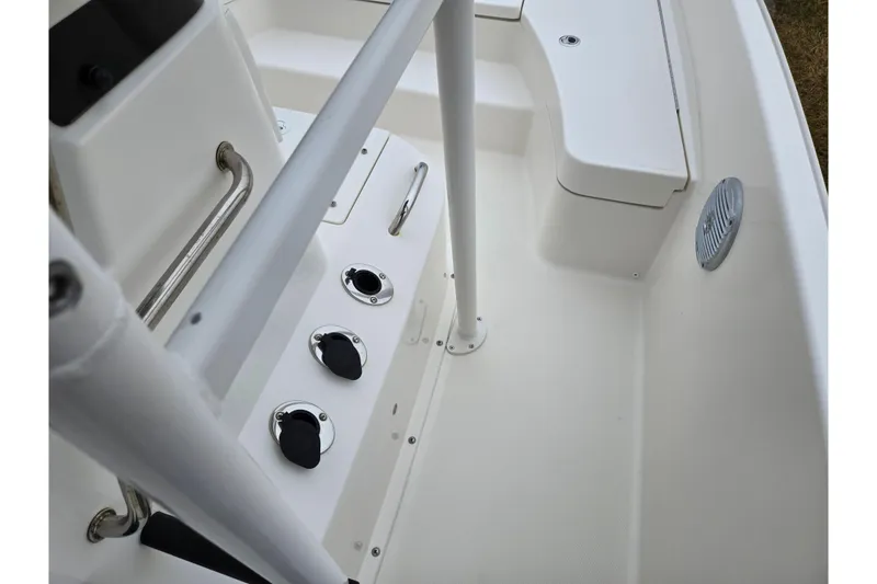 Slide: The Image of 2022 Bayliner Trophy T21Bay boat interior with seating and control panel. - 15