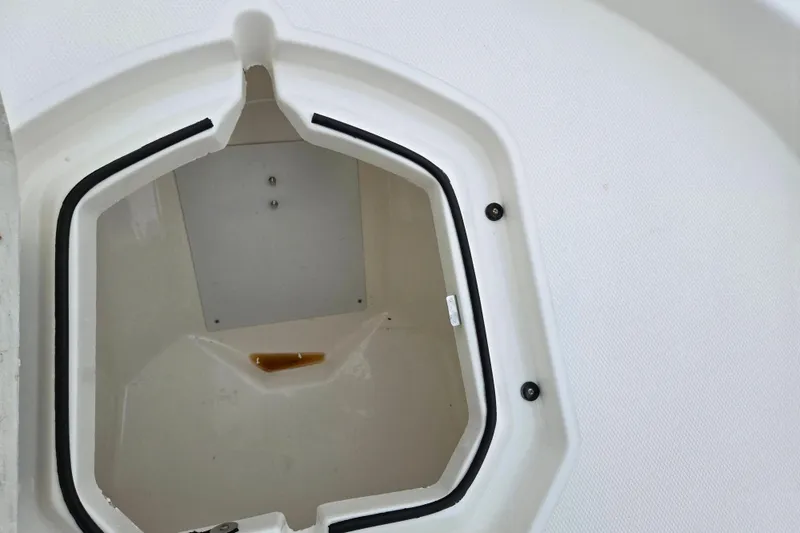 Slide: The Image of 2022 Bayliner Trophy T21Bay storage compartment with open hatch, showcasing interior details. - 19