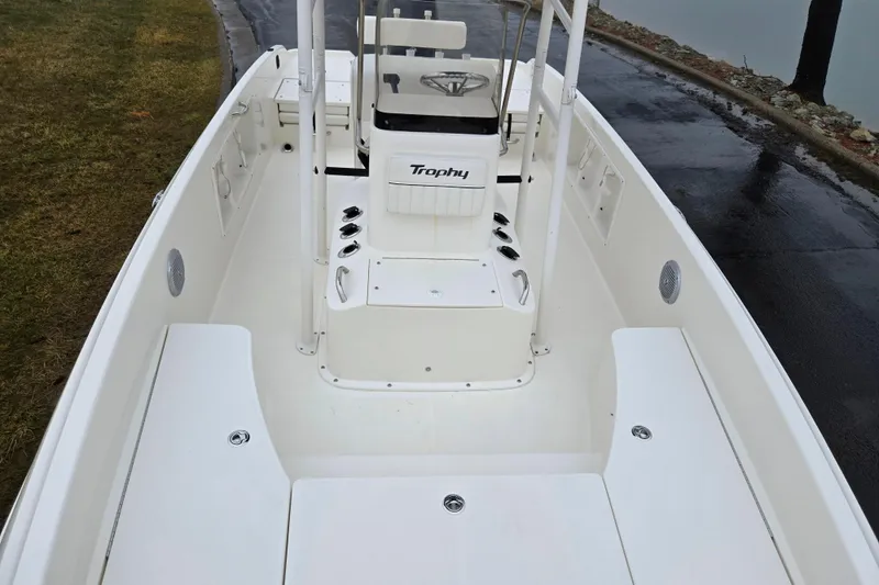 Slide: The Image of 2022 Bayliner Trophy T21Bay boat interior with seating and steering console. - 21