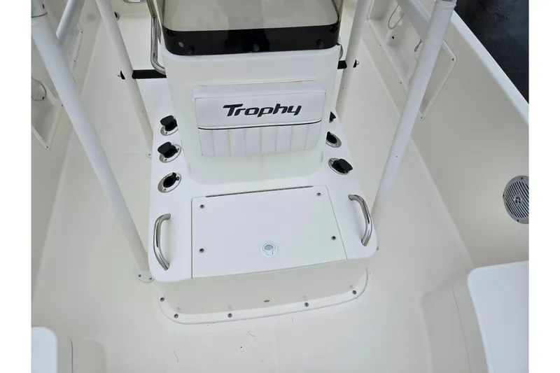 Slide: The Image of 2022 Bayliner Trophy T21Bay boat interior with storage and seating area. - 22