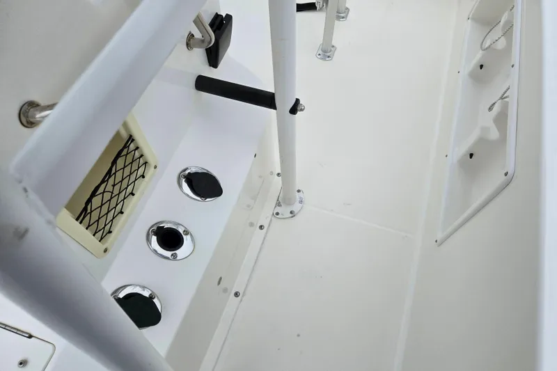 Slide: The Image of 2022 Bayliner Trophy T21Bay boat interior with storage compartments and fixtures. - 24