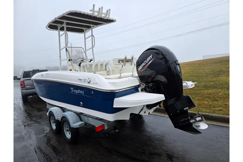 Slide: The Image of 2022 Bayliner Trophy T21Bay boat with Mercury engine on trailer. - 3