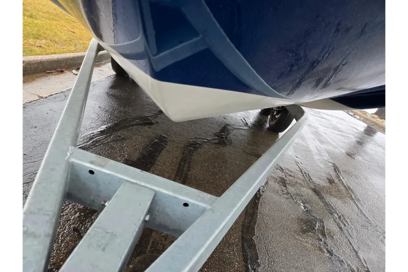 Slide: The Image of 2022 Bayliner Trophy T21Bay boat on trailer, close-up view. - 7