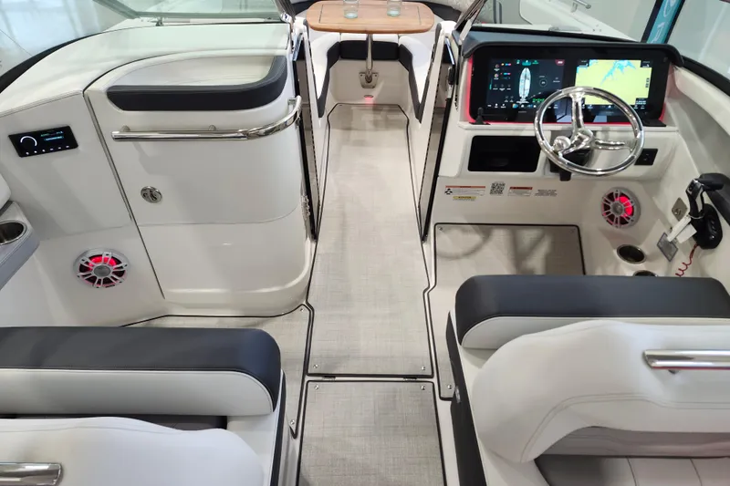 Slide: The Image of 2025 Regal LX6 boat interior with modern dashboard, steering wheel, and seating. - 21