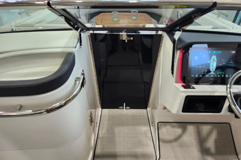 Slide: The Image of 2025 Regal LX6 boat interior with modern dashboard and seating area. - 31