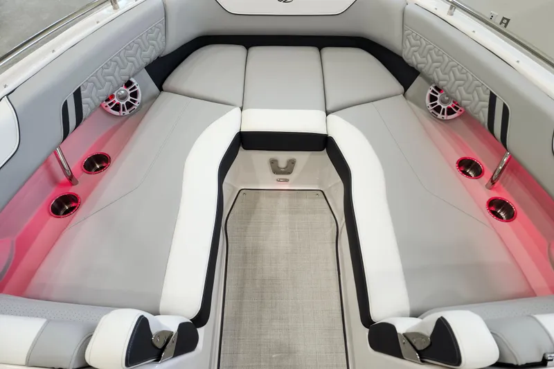 Slide: The Image of 2025 Regal LX6 boat interior with luxurious seating, ambient lighting, and modern design. - 35