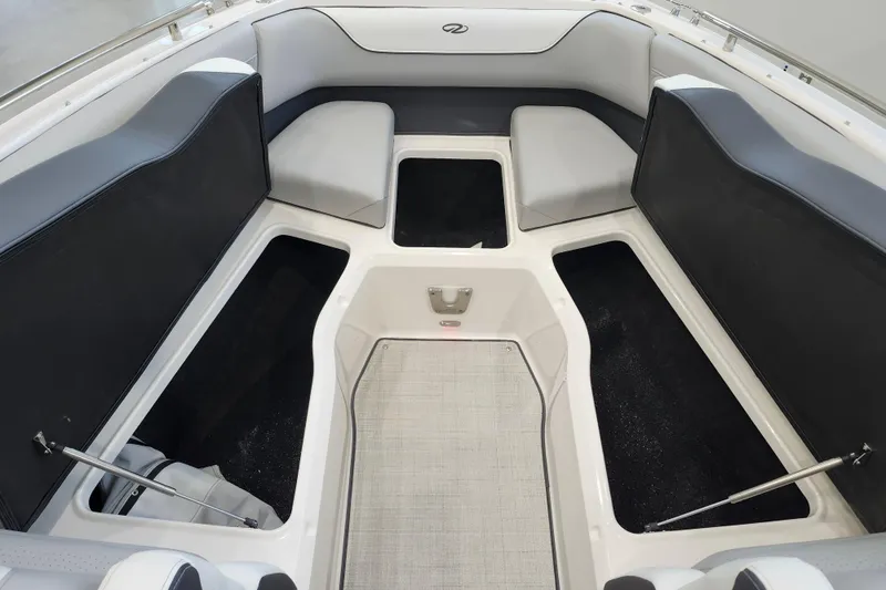 Slide: The Image of 2025 Regal LX6 boat interior with spacious seating and storage compartments. - 36