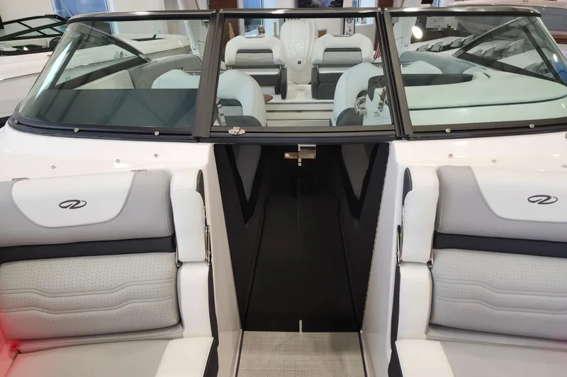 Slide: The Image of 2025 Regal LX6 boat interior with sleek seating and modern design. - 38