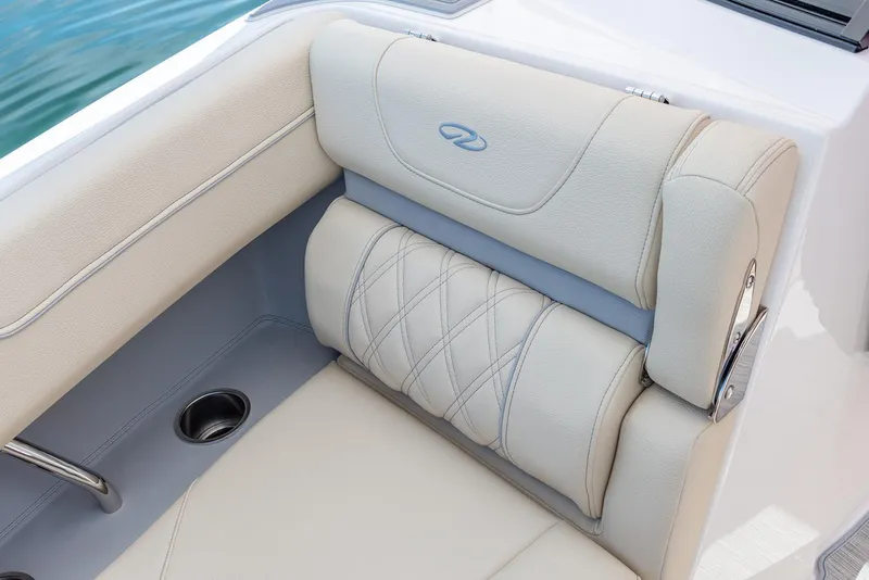 Slide: The Image of 2025 Regal LX6 boat interior with modern seating and ambient red lighting. - 9