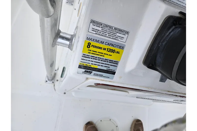 Slide: The Image of 2012 Sea Hunt Ultra 234 capacity label, maximum 8 persons or 1200 lbs. - 13