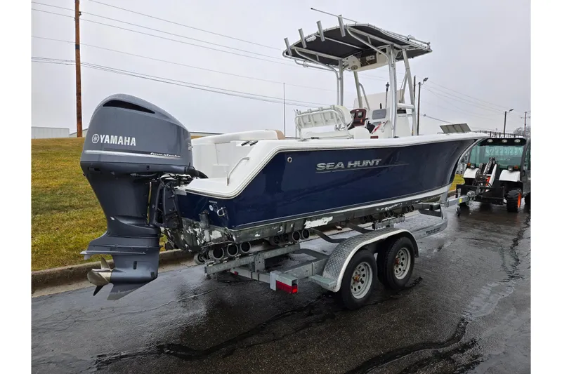 Slide: The Image of 2012 Sea Hunt Ultra 234 boat on trailer with Yamaha outboard motor. - 3