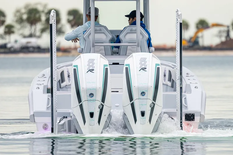 Slide: The Image of 2024 Dynamic D-305DF boat with dual 300R engines on calm water. - 10