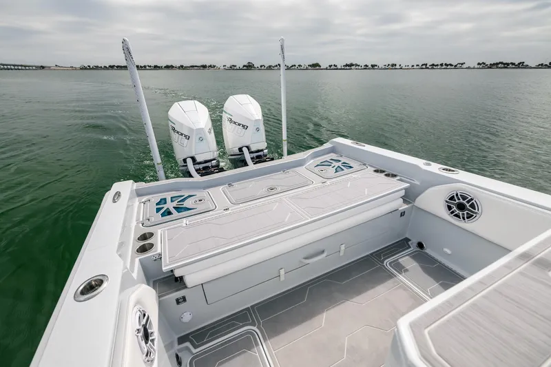 Slide: The Image of 2024 Dynamic D-305DF boat with dual engines on calm water. - 11