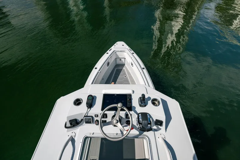 Slide: The Image of 2024 Dynamic D-305DF boat helm with advanced controls on calm water. - 23
